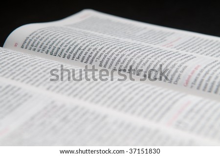 Closeup of a Dutch Bible on a black background