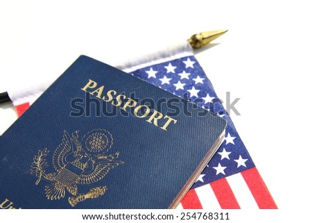 A horizontal image of an American passport on an American flag