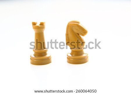 Chess knight and tower isolated on a white background