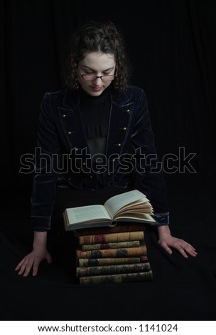 Woman reading a classic bound book.