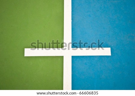 The White line between green floor and blue floor on soccer floor background