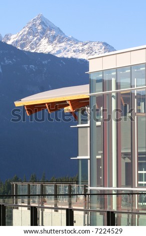 The curving roofline and glass architecture of a university in Squamish, BC, Canada.