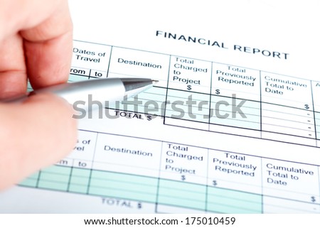 Pen in hand with business document
