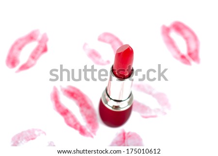 Lipstick on white background with red kiss