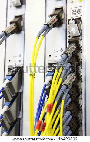 Fiber Optics connectors. Internet Service Provider equipment. Focus on fiber optic cables. Data Network Hardware Concept.