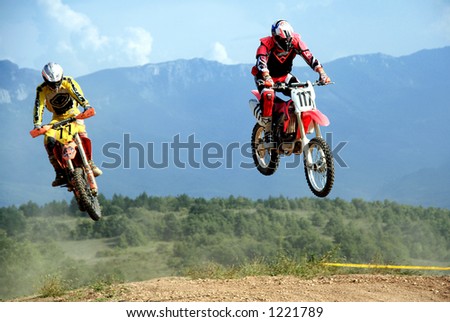 two motocrosses jump