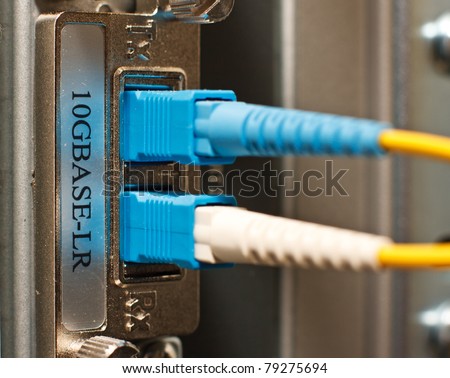 Fiber Optics with SC/APC connectors. Internet Service Provider equipment. Focus on fiber optic cables. Data Network Hardware Concept.