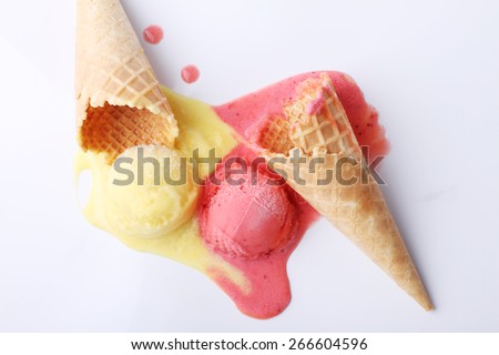 yellow passion fruit and red strawberry ice cream dropped melt on white background