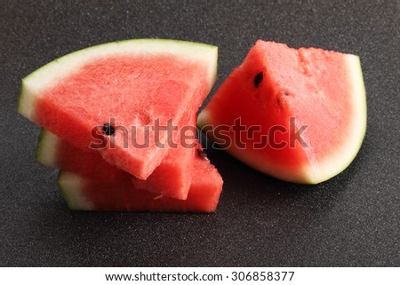 Watermelon, Slices of fresh watermelon on black background