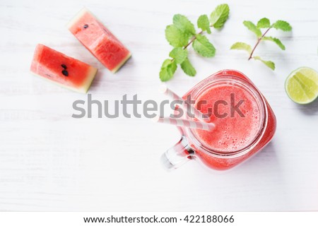 Healthy watermelon drink and fresh watermelon on white background