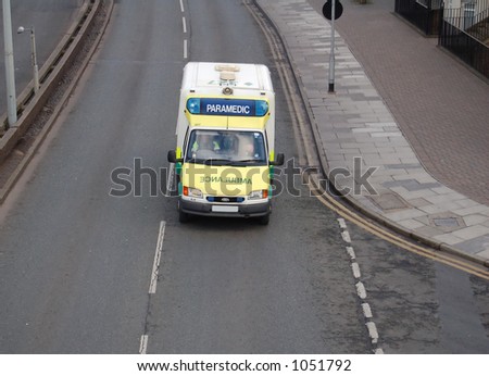 Paramedic ambulance on the way to an emergency with blue lights on