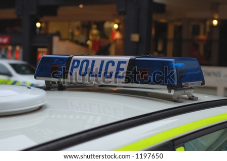 stock photo : Close up of blue lights on top of a UK police car.
