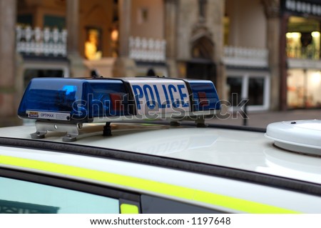 stock photo : Close up of blue lights on top of a UK police car.