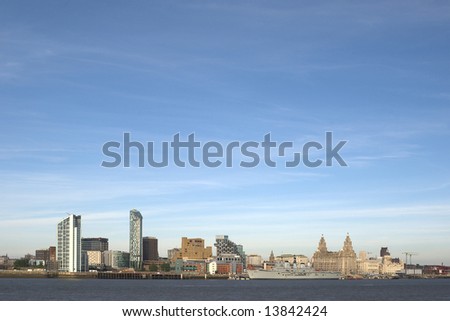 Liverpool Waterfront with the Royal Navy Ship Ark Royal berthed on the docks showing the famous Liverbirds