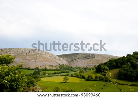 Lush green valley with a mountain in the distance called worlds end near Llangollen in North Wales UK