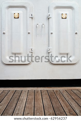 closing the door on the white wall and wooden floor