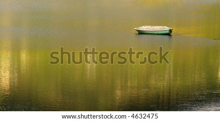lonely boat on peaceful water