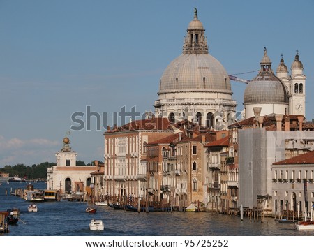 VENICE, ITALY - JULY 2: The tourism season starts, and tourist and locals travel in Gondolas and boats on the Grand Canal of Venice, Italy July 2, 2011 in Venice, Italy