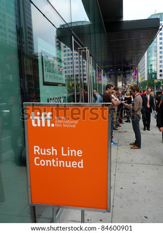 TORONTO - SEPTEMBER 13: People gather for rush line at the TIFF Bell Lightbox hours before film screening for the 36th Toronto International Film Festival Sept 13, 2011 in Toronto, Canada