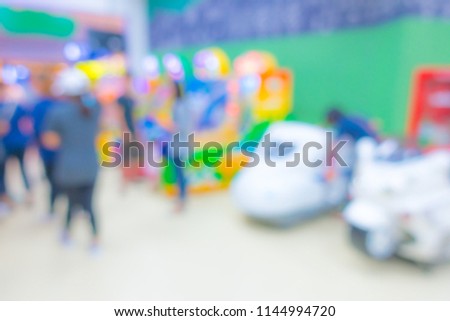 Abstract blur people in Interior game zone of shopping center