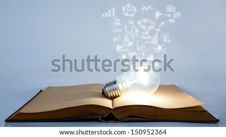 Book and light bulb with business graph