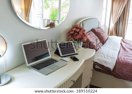 Interior of a modern bed room with laptop computer