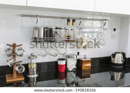 Kitchen cabinets with coffee corner in modern home living room.