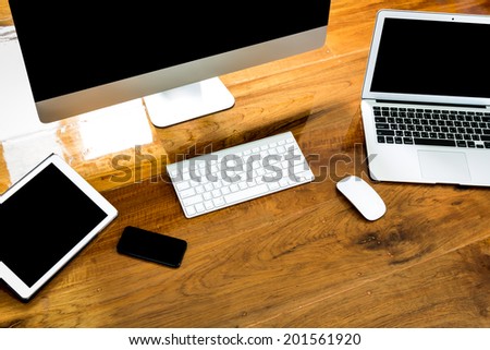 Computer ,laptop , tablet , smart phone on wood table