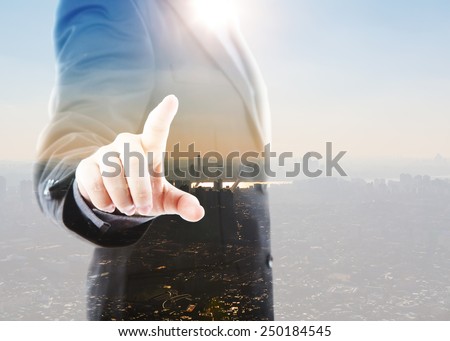 Abstract Double exposure of Business man touching an imaginary screen against white background
