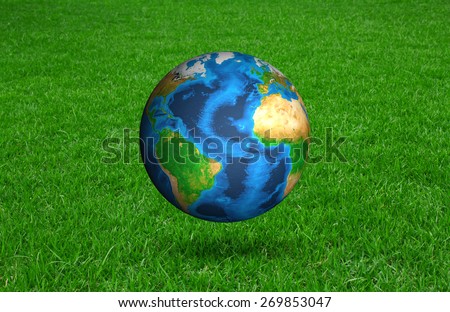 Earth in Fresh spring green grass (Elements of this image furnished by NASA)
