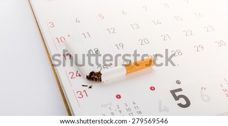World No Tobacco Day : Broken cigarette on calendar ,sun flare filter effect