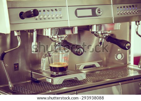 Prepares espresso in coffee shop ( Filtered image processed vintage effect. )
