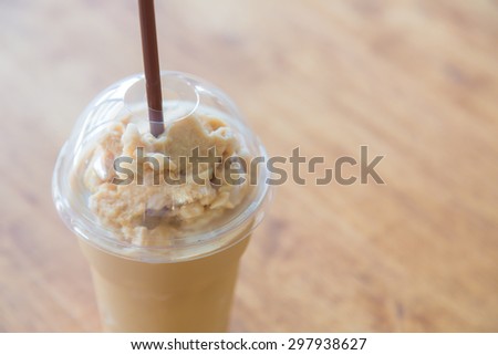 Milk coffee smoothie in plastic cup