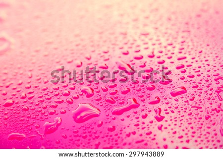 Drops of water on red  floor