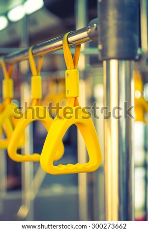 Handles passenger inside a bus.  ( Filtered image processed vintage effect. )
