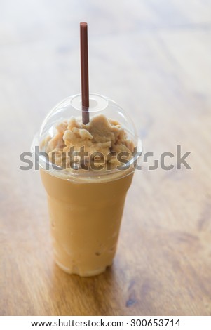 Milk coffee smoothie in plastic cup