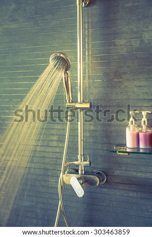 Shower while running water ( Filtered image processed vintage effect. )