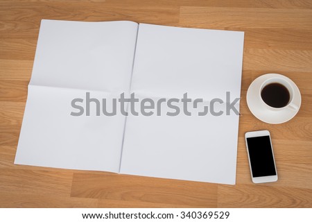 Blank Newspaper with empty space and coffee cup ,mobile phone mock up on wood background