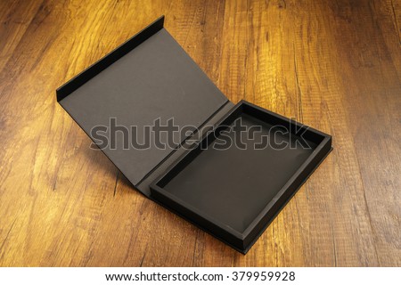 Blank black box mock up on wood background
