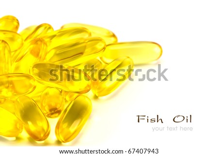Capsules of fish oil and vitamins on white background.