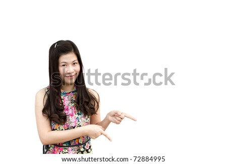 Young girl pointing down, isolated on white background.
