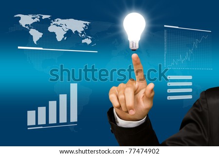 Business man point light bulb in his hand
