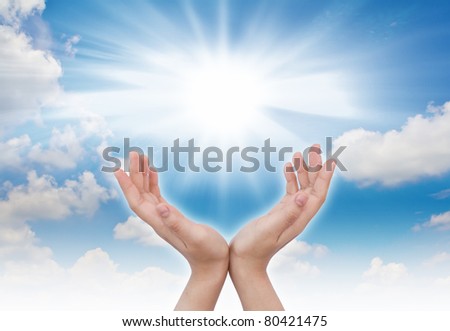 hand sun and blue sky with copyspace
