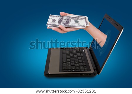 A Hand reaches out of an Laptop with a Dollar