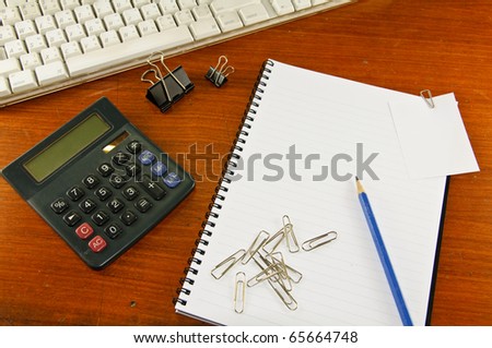 paper clip paper-note notebook pen pencil keyboard and calculator
