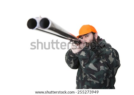 Duck hunter with orange safety hat aiming a double barreled shotgun on a white background