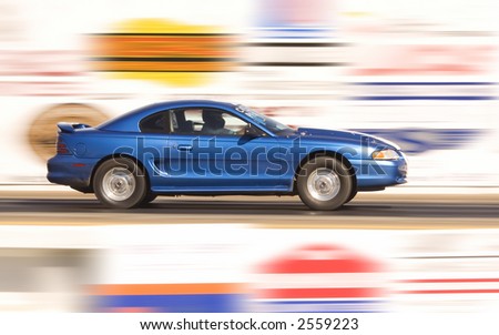 Fast moving sports car shot using slow shutter speed
