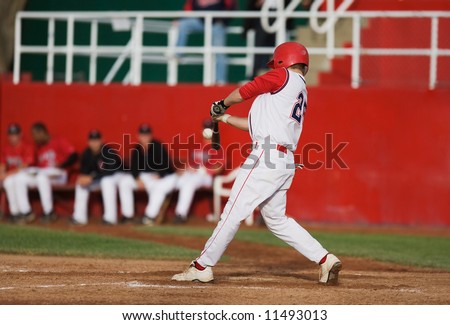 Baseball player makes contact with the ball