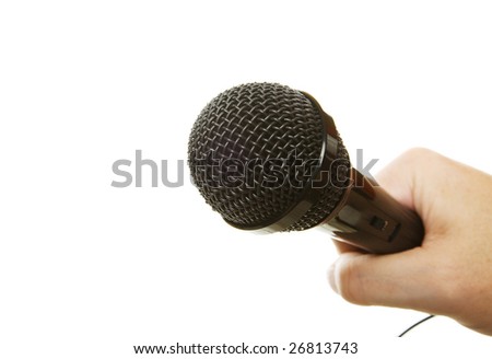 A hand holding a microphone on a white background