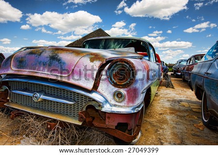 stock photo Old abandoned vintage cars rusting in a ghost town